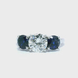 Round Brilliant Diamond & Blue Sapphire Three-Stone Engagement Ring