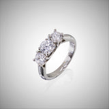 Platinum 3 stone trellis style mounting.