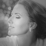 14kt White Gold Huggie with .50cttw of channel set round diamonds. G-H color, SI2 clarity