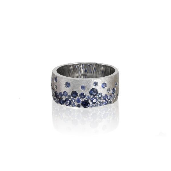 14KW Sapphire mix blue flush set cigar band ring in a satin finish. 8.7MM wide, 1.34 total carat weight