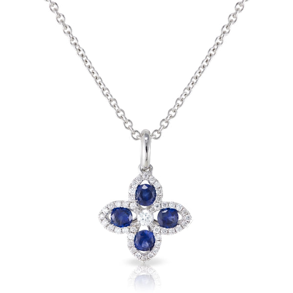 18kt White gold clover pendant.  4 round sapphires weighting .35 carats and 41 round diamonds weighing .13 carats.  G color Si clarity