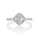 18kt White Gold and diamond ring.  The ring is set with a diamond shaped bouquet with a halo and diamonds down the shank.  43 round diamonds weighing .60 carats, G color/SI clarity