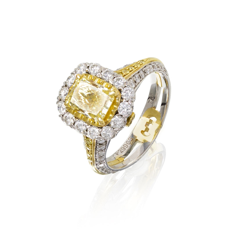 18kt yg/wg fancy yellow diamond 1.33ct and SI2 clarity, ring with round diamonds on bezel and down shank 0.99cttw G/SI1 along with fancy Yellow diamonds on shank and under bezel 0.17cttw.  