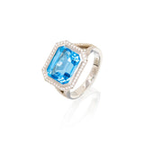 Lady's 18kt white gold custom ring with a genuine swiss blue topaz in center. Topaz weighs approx 6.00 carats total weight. Diamonds within the setting weigh a total of approx 0.35cttw. The diamonds are G Color, VS Clarity.