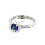 14K WG .81ct Blue Sapphire, round with .41cttw GHSI rbc diamonds