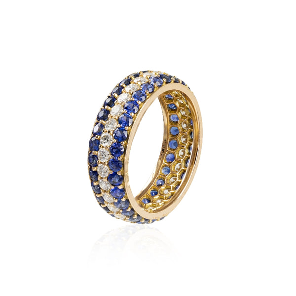 Diamond and sapphire band, 3 rows. Two rows of royal blue sapphires, weighing 2.46cttw, (60) and 30 diamonds .81ctw, G color and SI clarity.  All gems are round and set into 18kt pink gold. 