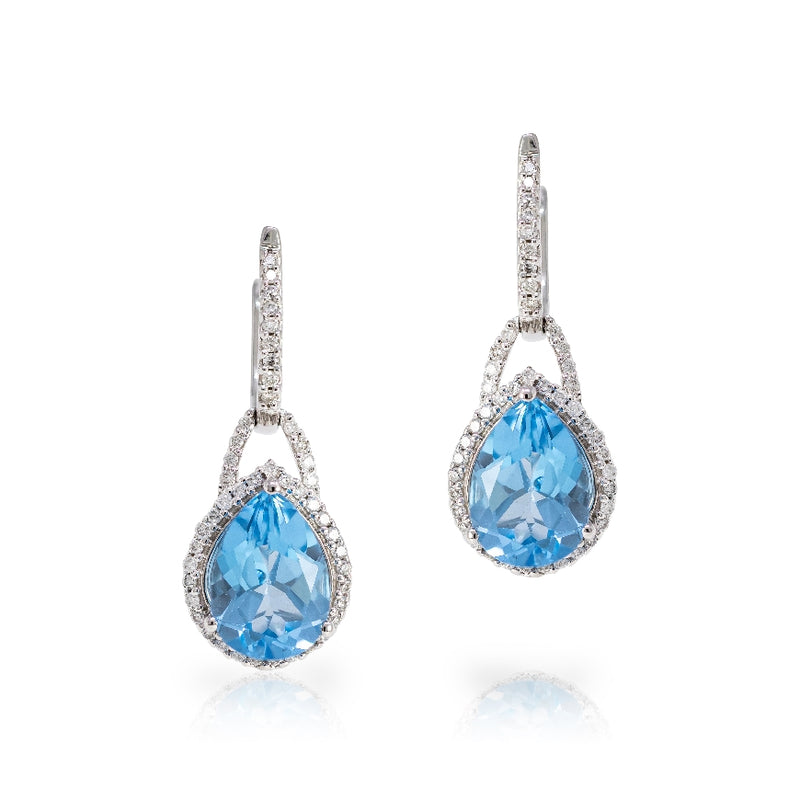 14kt white gold pear shaped blue topaz drop earrings with diamonds on hoop and surrounded blue topaz. Blue topaz weigh 4.20cttw and diamonds weigh 0.40cttw. G-H,SI