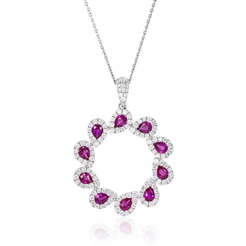 Ladies 18ktwg ruby and diam necklace/pendant, wreath design with diam bale. Diamonds total 1.29ct and rubies total 2.0ct.  Diamonds are G-H, VS.