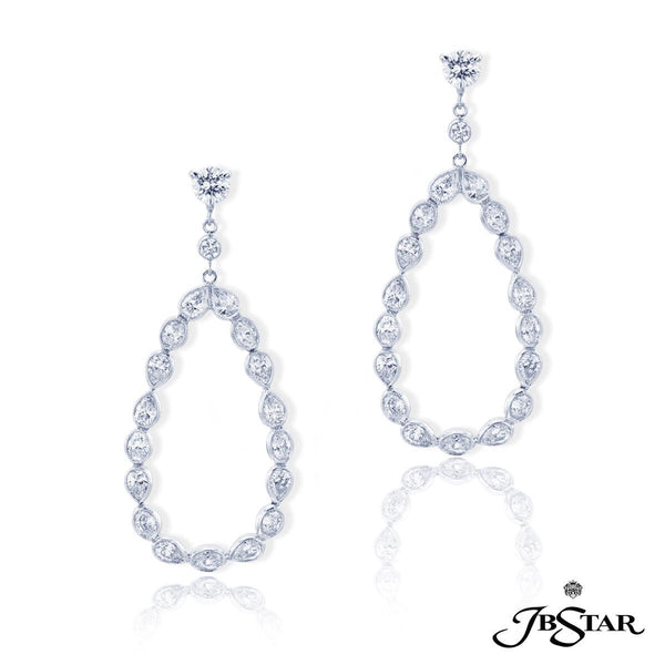 1951-001 Diamond hoop earrings handcrafted in a combination of carefully matched oval and pear-shaped diamonds to form the perfect hoop. Platinum.