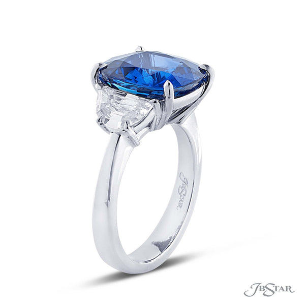 Magnificent sapphire and diamond ring featuring a 7.36 ct. certified Sri Lankan cushion cut sapphire embraced between two half moon diamonds.