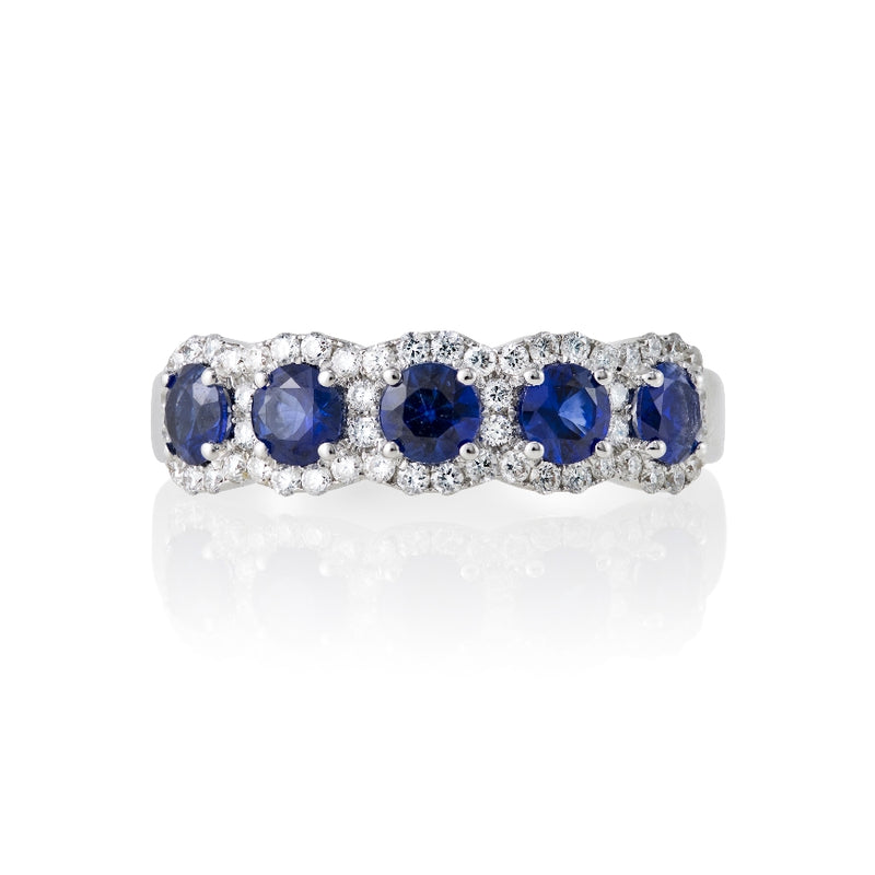 18kt white gold ring with 5 sapphires weighing .72cttw in a micro pave halo setting.  diamonds .18cttw