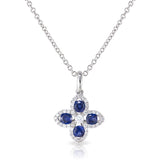 18kt White gold clover pendant.  4 round sapphires weighting .35 carats and 41 round diamonds weighing .13 carats.  G color Si clarity