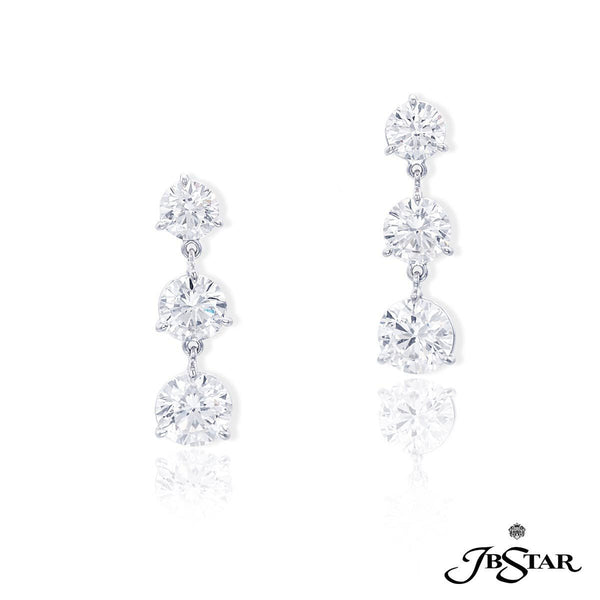 Platinum diamond earrings handcrafted with perfectly matched cascading diamonds.